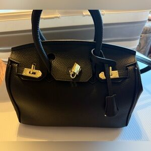 Elegant Black Leather 'Wirkin' Handbag with gold hardware. Size 30